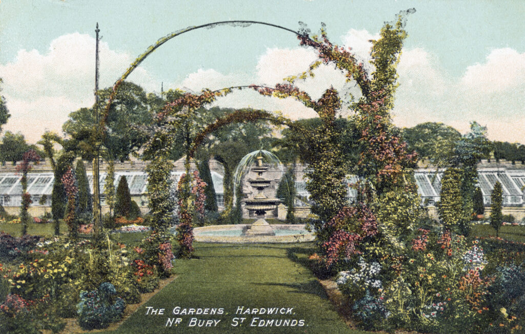 Postcard of the gardens and fountain of Hardwick House with rose arches