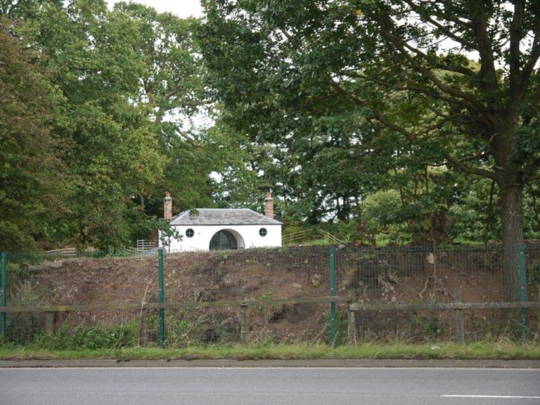 Tabley gate lodge showing earth mound