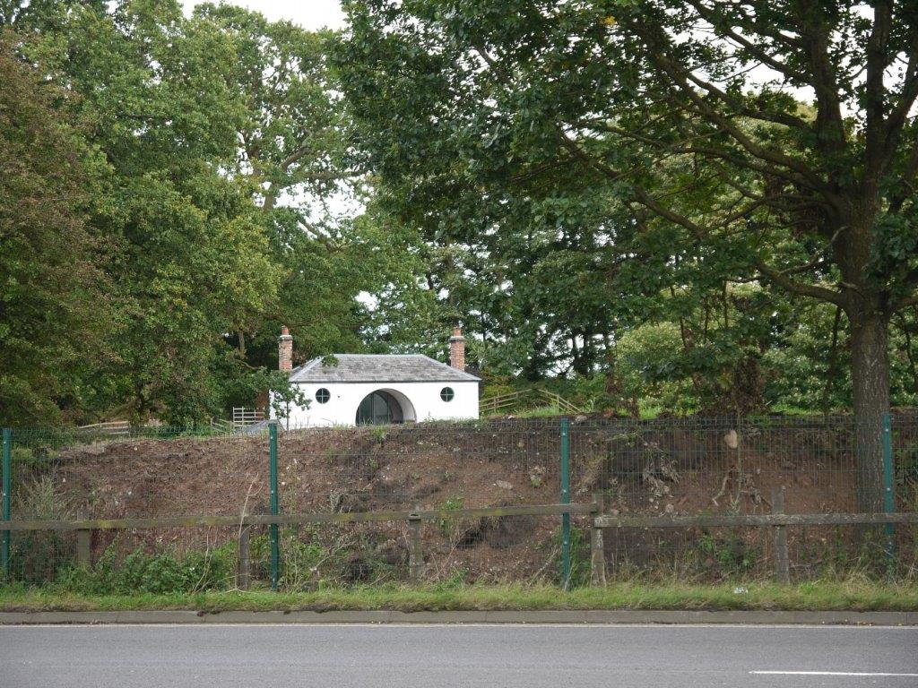 Tabley gate lodge showing earth mound