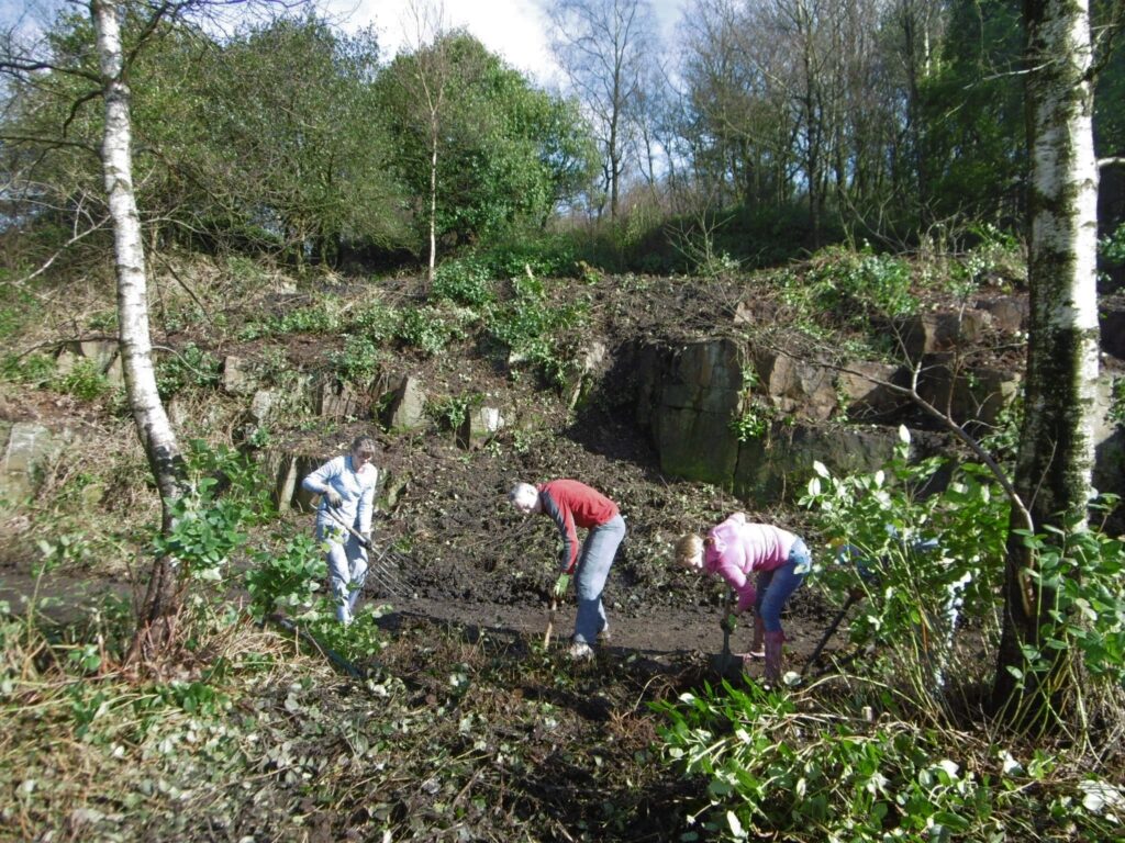 Volunteers at work on a cleared hillside in Rivington Terraced Gardens