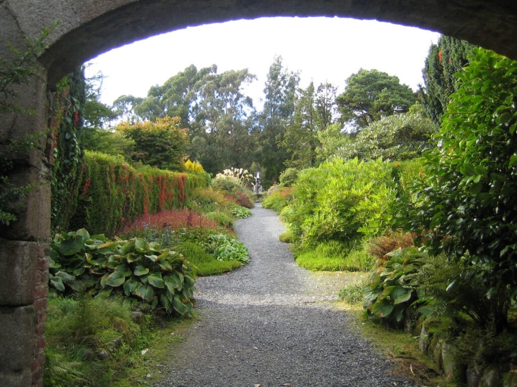 View through an arch to a herbaceous walled garden at Castlewellan.