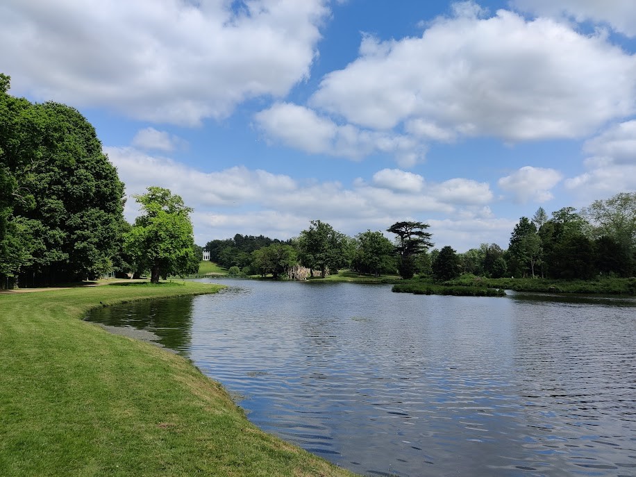 Image of a lake and mature trees in a historic designed landscape