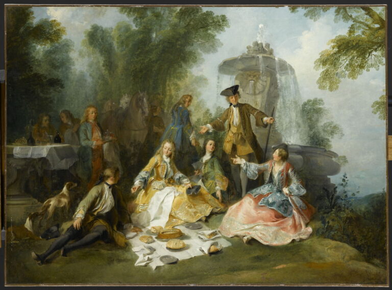 A group of Georgians eating sat outdoors